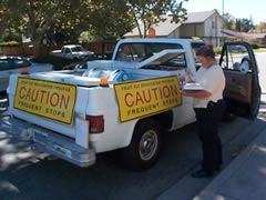 Photo of an inspector monitoring Oriental Fruit Fly spraying.