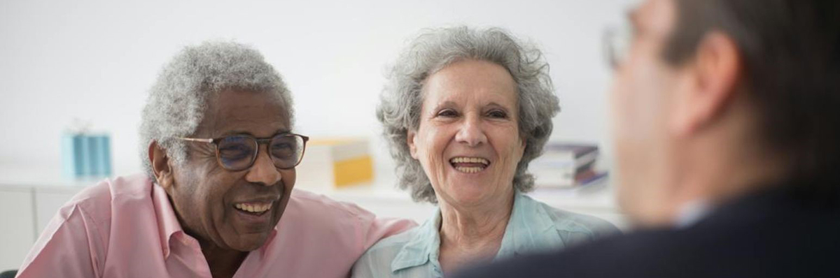 Elderly couple laughing together